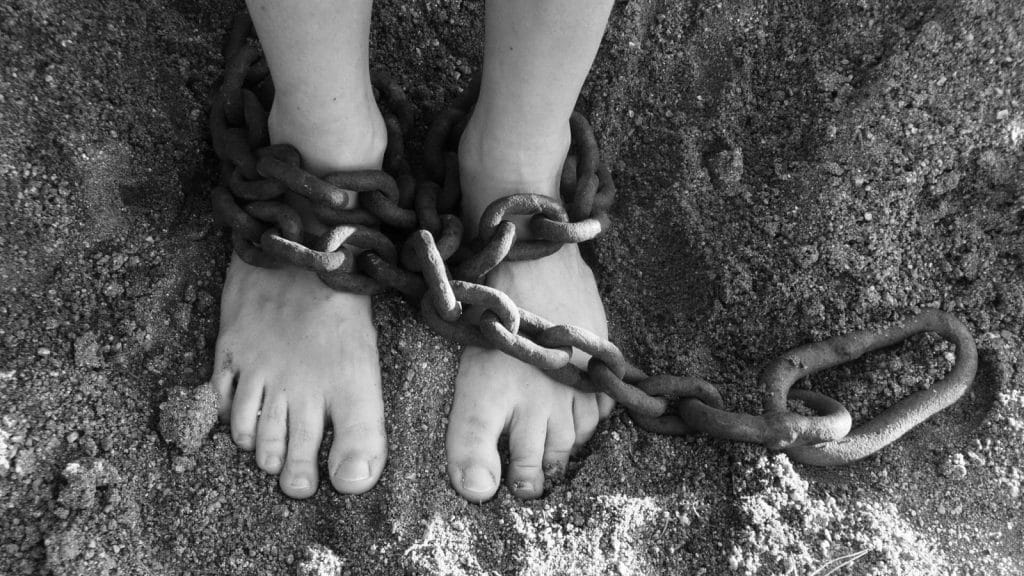 victim of human trafficking in chains