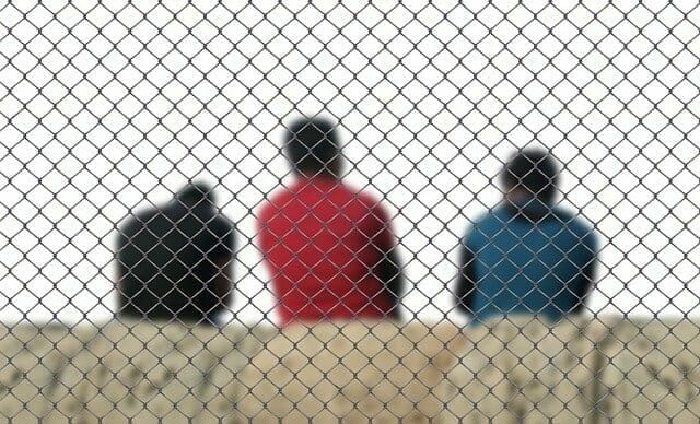 asylum seekers behind bars